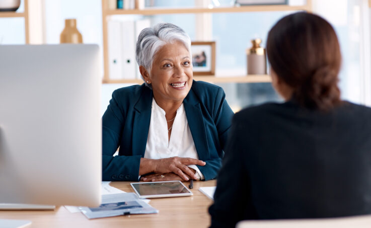 A female HR professional interviewing a candidate
