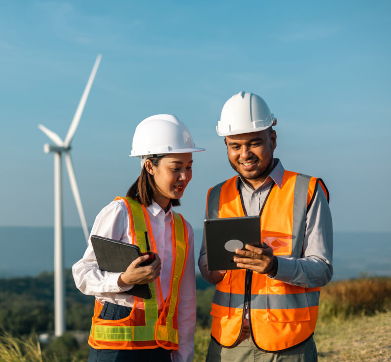 Two turbine techs reviewing tablets 