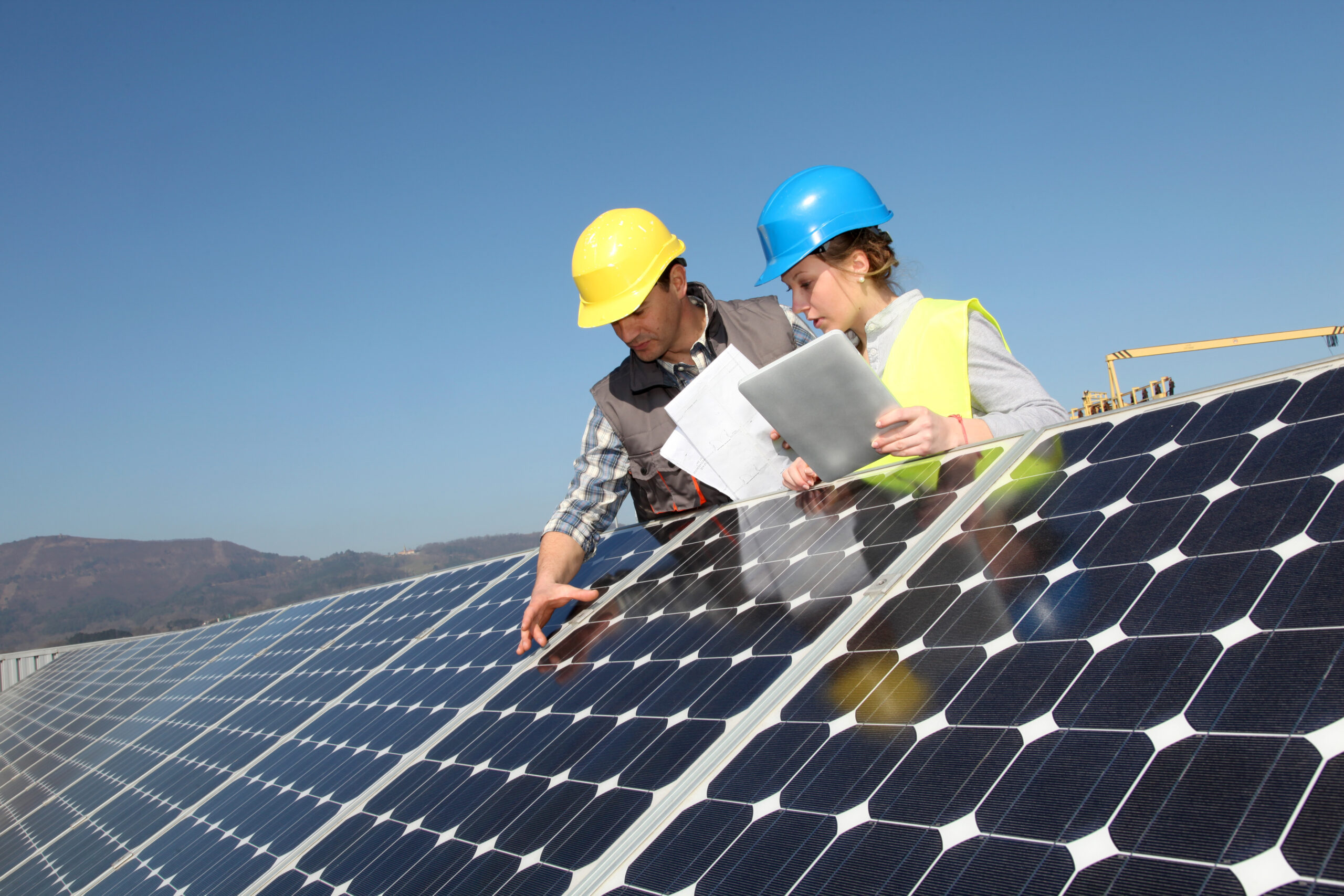 Man showing solar panels technology to student