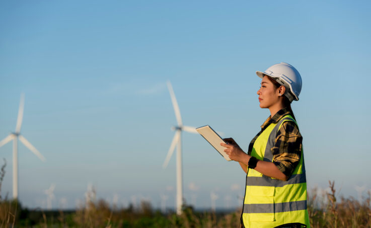 Female wind turbine technician in the field
