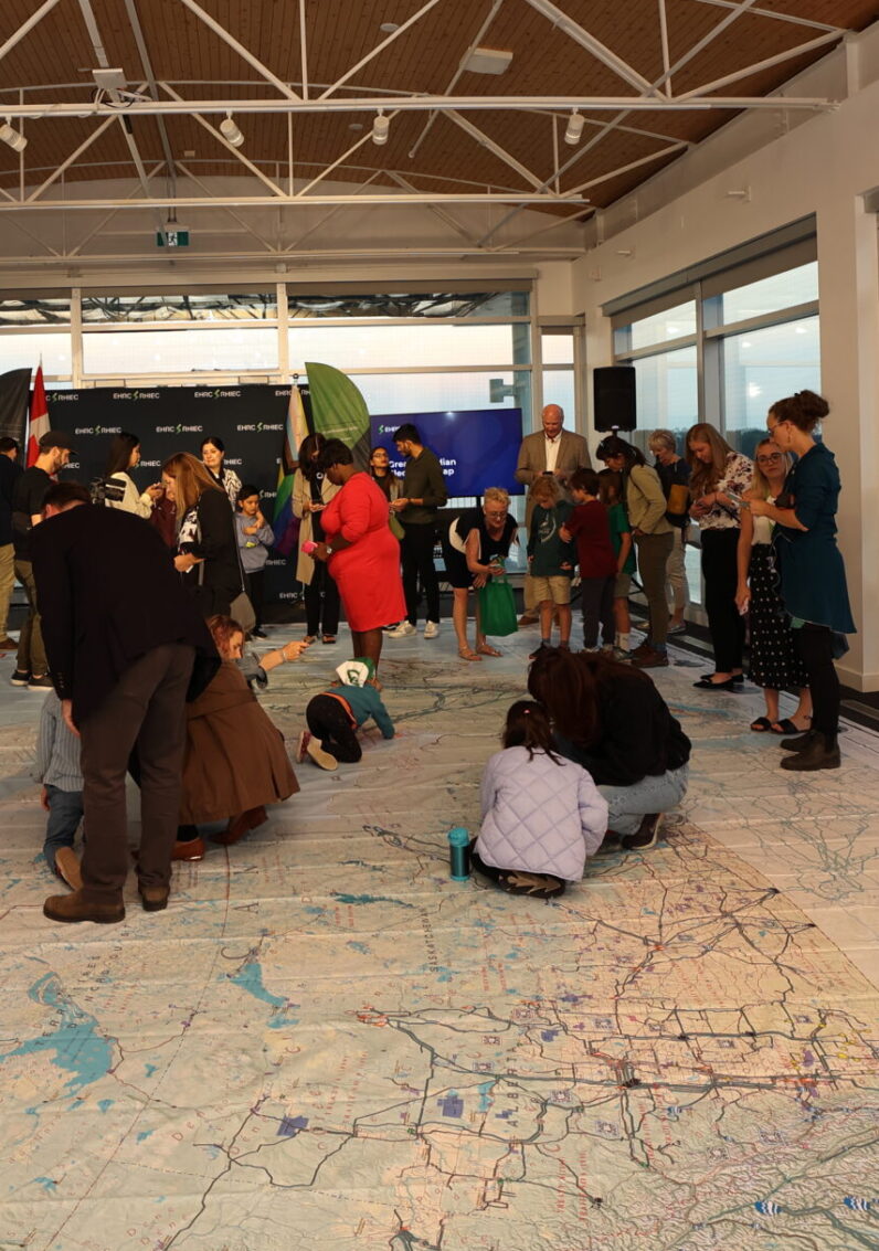 Children scanning QR codes on the map