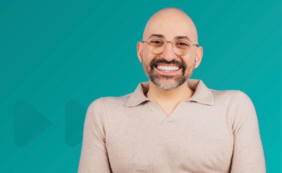 Photo of Spencer West on a teal background