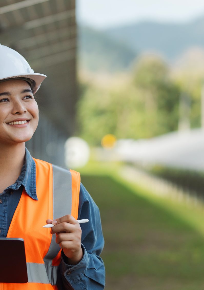 Happy woman in safety gear